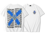 T-shirt oversize blanc coton premium avec logo khamsa bleu côté cœur et au dos motif répété I’M ORIGINAL YOU’RE FAKE en noir, recouvert d’une grande croix bleue texturée et d’un logo khamsa bleu avec œil central bleu clair cerclé de jaune