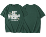 T-shirt oversize premium vert foncé avec grand slogan NOT WORTH IT en blanc, billets de banque imprimés en design graphique streetwear et texte Not everything has a price, dos uni sans motif